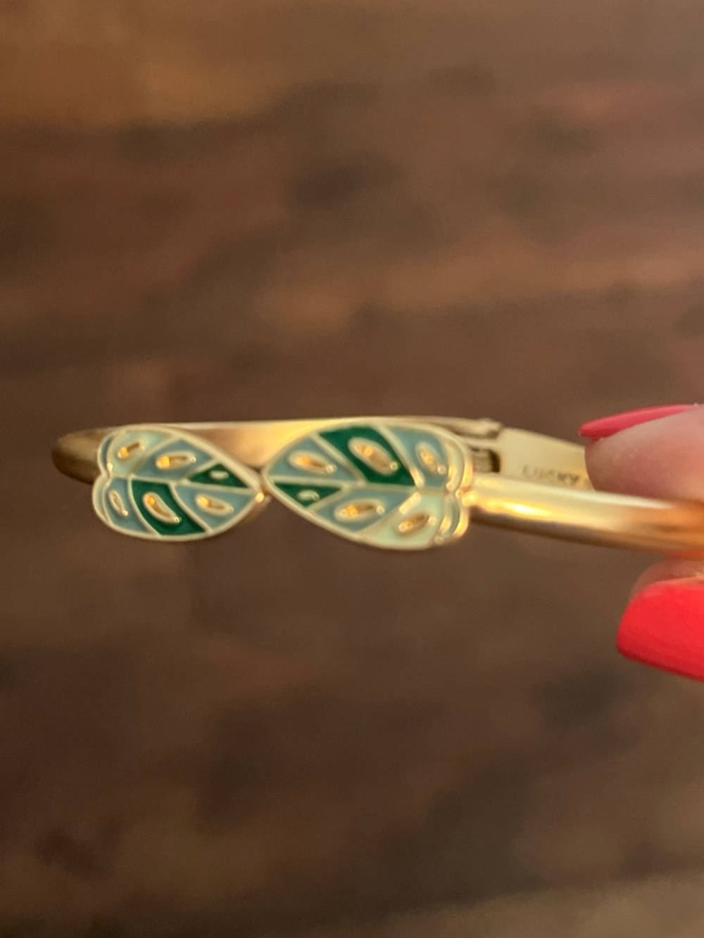 Lucky Brand Gold Tone Hinged Bangle with Green Enamel Detail
